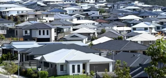 Australian homeowner reviewing home loan refinancing options during uncertain interest rate conditions