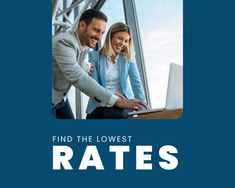 Two professionals reviewing home loan options on a laptop to find the lowest interest rates in Australia
